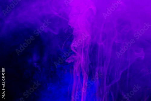 Smoke colorful background. Neon colors explosion. Blue pink smoke flowing.