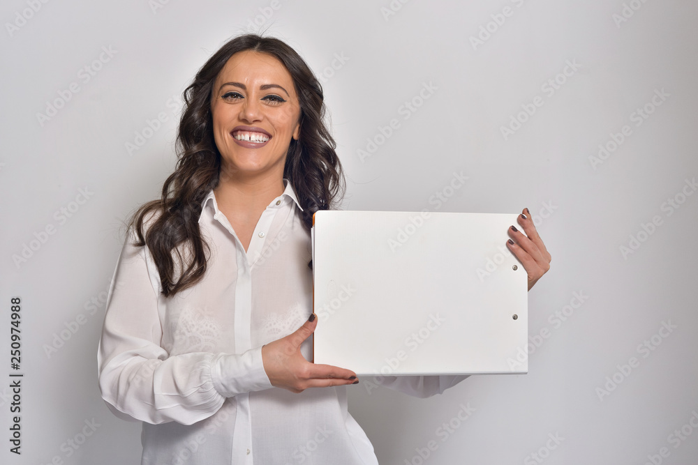 Girl holding a sign isolated on white. Girl holding a sign isolated on white.