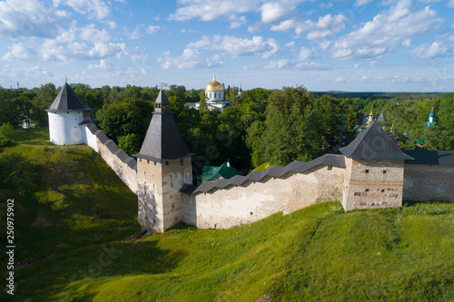 View of the towers of the Holy Dormition Pskov-Caves Monastery on a sunny June day (aerial survey). Pechory, Russia