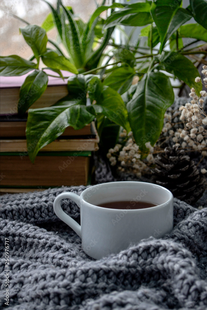 coffee and books on a cozy blanket with flowers coffee and books on a cozy blanket with flowers