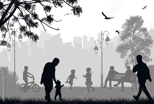 People silhouettes in a city park