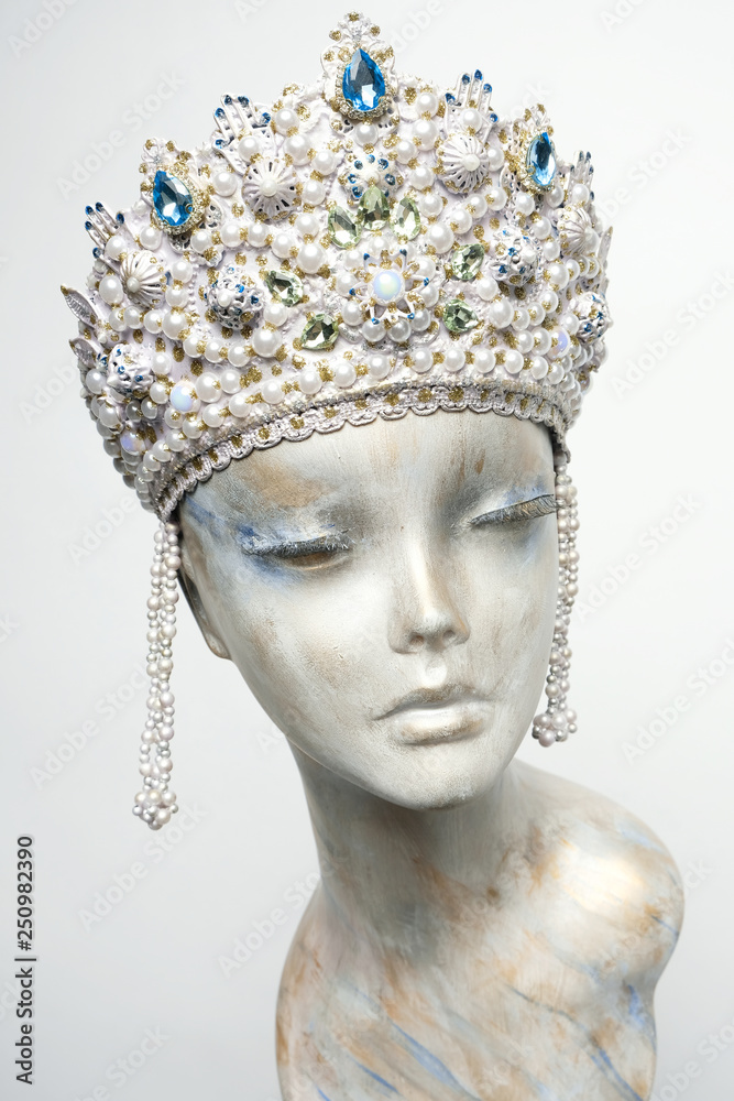 Mannequin head in creative Russian white kokoshnick with jewels and pearls