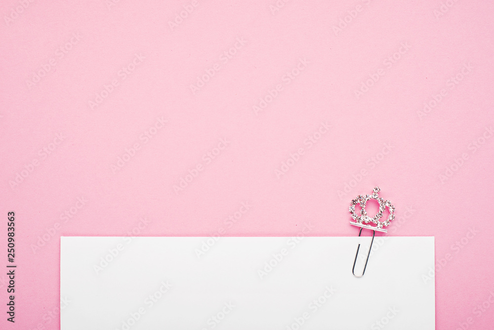 Background pink envelope shiny princess crown. The concept of an invitation to the holiday of the birth of a little girl princess. Horizontal. Copy space.