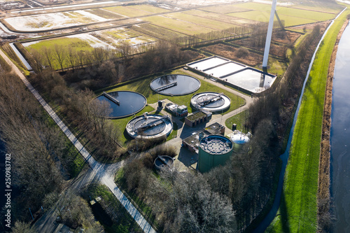 A dutch water treatment plant for cleaning the sewage water, seen from above during sunset. Near Waalwijk, Noord-Brabant, Netherlands.