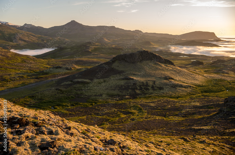 Obraz premium Dreamy misty landscape above the sea of clouds, mountains at sunset in Iceland