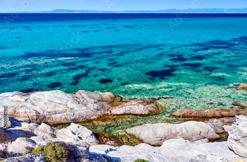 Rocky coast and turquoise sea in Greece photo