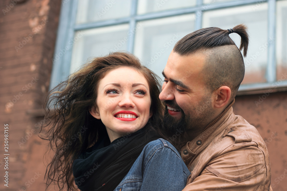 modern couple in love standing on the street of the city modern couple in love standing on the street of the city