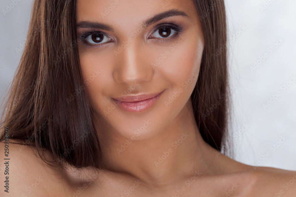 Young charming brunette. Beauty portrait of a young beautiful woman Young charming brunette. Beauty portrait of a young beautiful woman