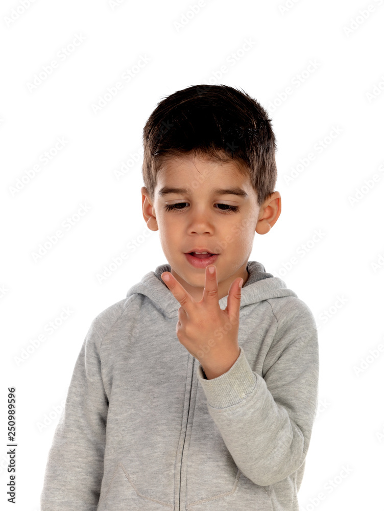 Dark haired child showing two fingers
