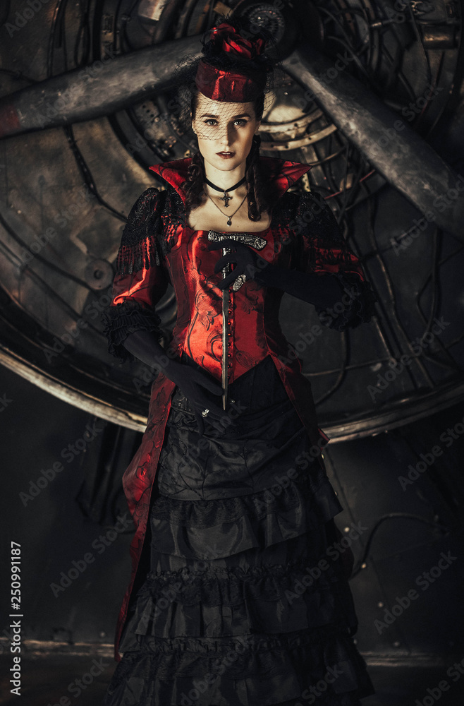 Gothic lady in 19th century red dress Stock Photo