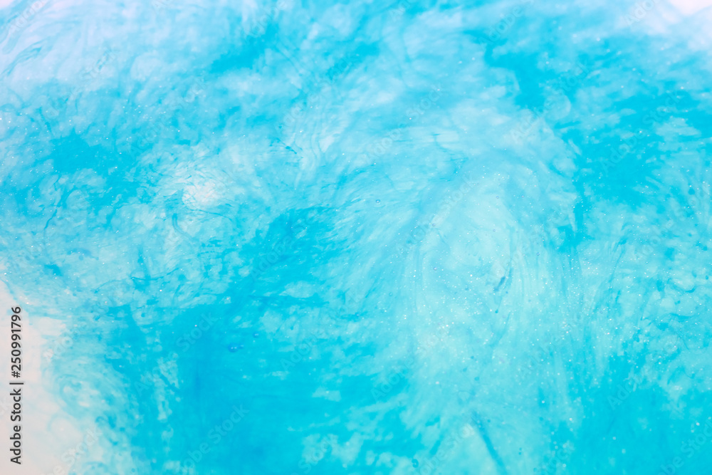 paint in water surface, sky blue abstract background