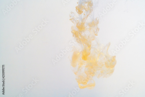 golden paint in water, explosion of paint under water ink.