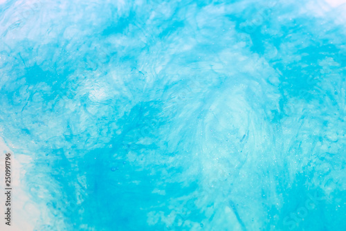 paint in water surface, sky blue abstract background