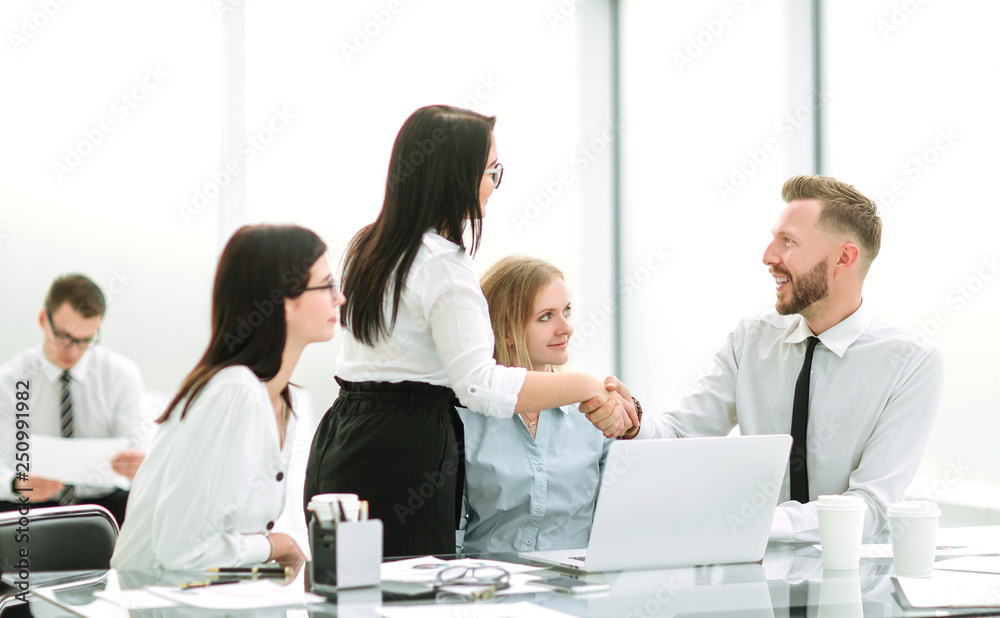 handshake of business people in the workplace in the office handshake of business people in the workplace in the office