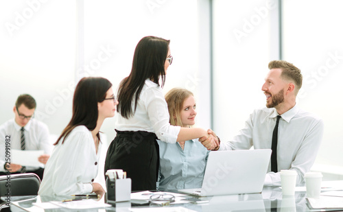 handshake of business people in the workplace in the office