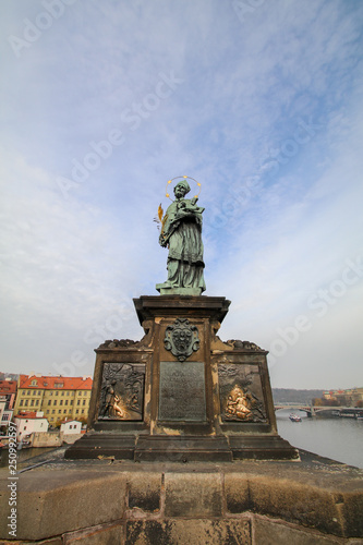 Statue of St. John of Nepomuk in Charles Bridge, Prague old Town