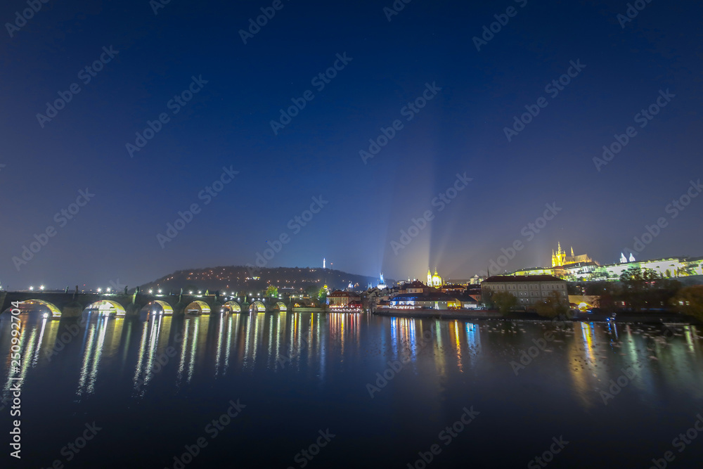 View on Charles bridge on Vltava river in Prague at night, Czech Republic View on Charles bridge on Vltava river in Prague at night, Czech Republic