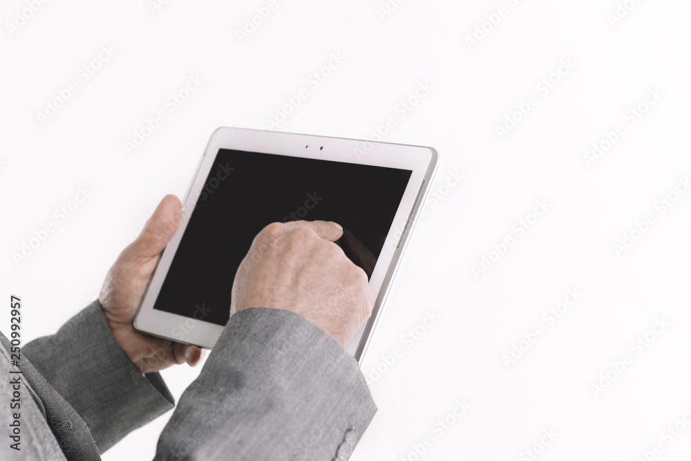 close up.businessman pointing finger at the digital tablet screen.isolated on white background