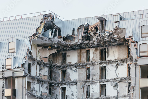 Photo of destroyed building, former hotel 5 stars/ demolition of a building, house ruins, rebirth, reconstruction, bricks and metal/ destruction of the walls, abandoned hotel, multi-storey building. © Denis Mamin