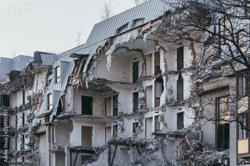 Photo of destroyed building  former hotel 5 stars  demolition of a building  house ruins  rebirth  reconstruction  bricks and metal  destruction of the walls  abandoned hotel  multi-storey building.