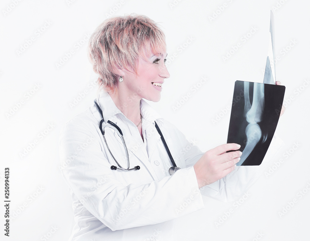female doctor checking x-ray of the patient . female doctor checking x-ray of the patient .
