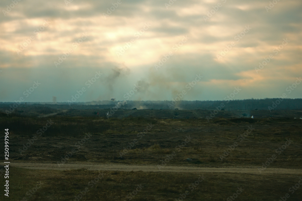 Obraz premium Hostilities. War concept. Military training ground with the explosions.