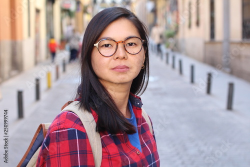 Fotografie Cute Asian woman with neutral expression