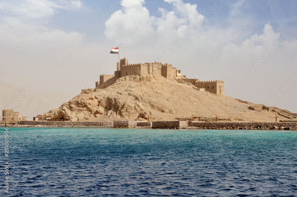 Egypt, Taba, 14-08-2018 years, Saladin castle, view from the sea, a fortress with towers and flag