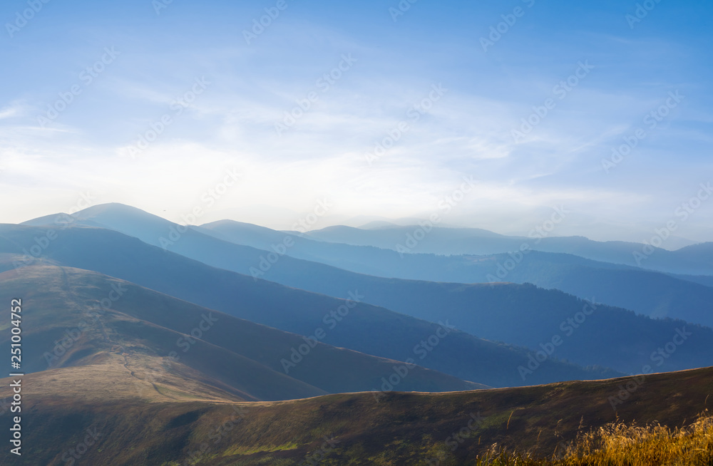 beautiful mountain valley in a blue mist