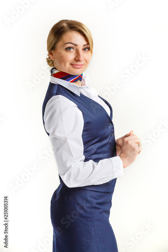 Portrait of charming stewardess wearing in blue uniform. Isolated on white background.