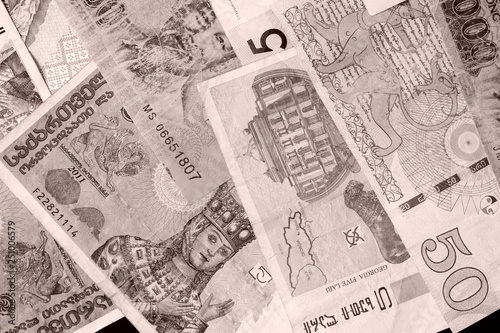 Wallpaper Mural Different countries money background close up. Brown color toned Torontodigital.ca