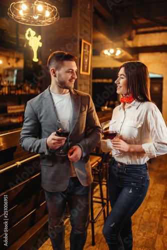 Man and woman drinks red wine at bar counter © Nomad_Soul