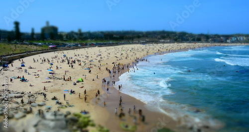 People relaxing at the beach on a hot sunday in Spring time. Bondi beach, Sydney, NSW, Australia.