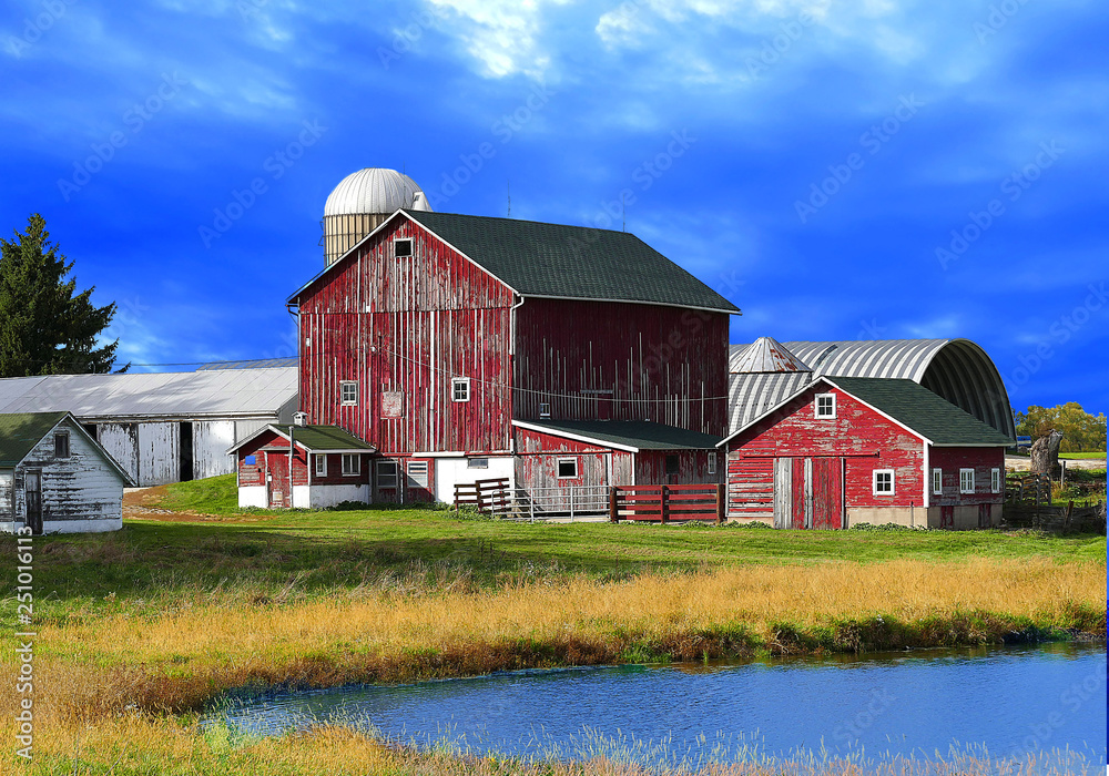 red barns against deep blue sky