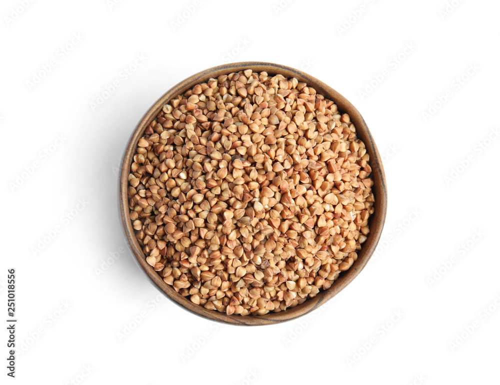 Bowl with uncooked buckwheat on white background, top view Bowl with uncooked buckwheat on white background, top view