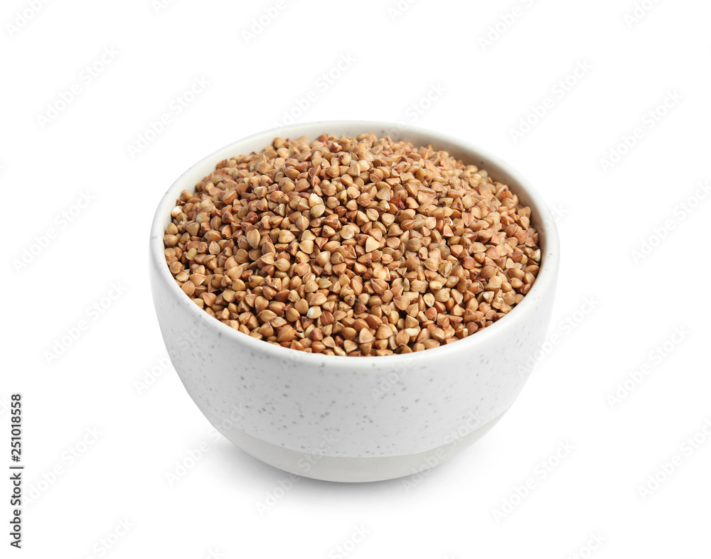 Bowl with uncooked buckwheat on white background Bowl with uncooked buckwheat on white background