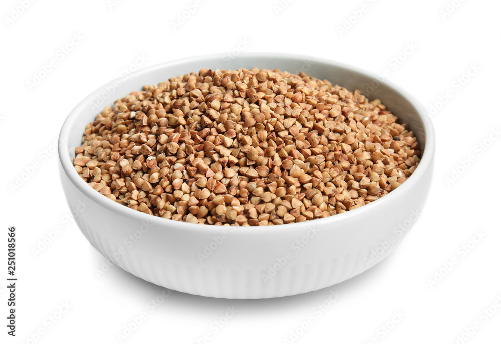 Bowl with uncooked buckwheat on white background Bowl with uncooked buckwheat on white background