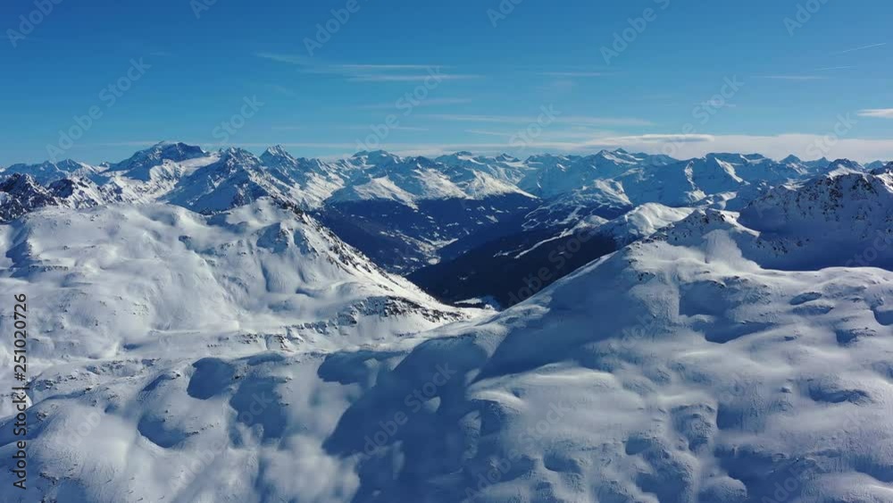 Aerial panoramic view of Alps, landscape panorama of snowy mountain range in winter, sunny day with blue sky - Alps from above, Livigno, Italy, Europe Aerial panoramic view of Alps, landscape panorama of snowy mountain range in winter, sunny day with blue sky - Alps from above, Livigno, Italy, Europe