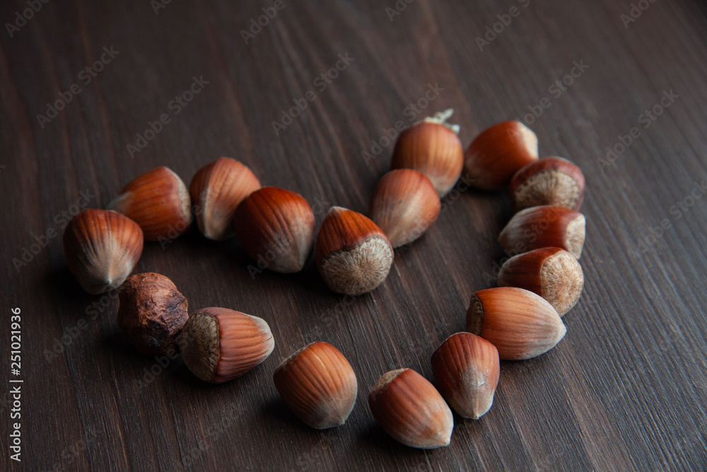 Obraz premium hazelnuts on wooden background