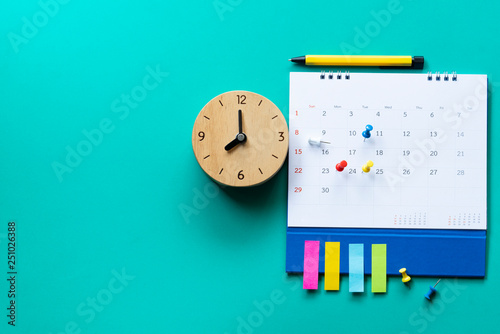 Tableau sur toile close up of calendar and clock on the green background, planning for business me