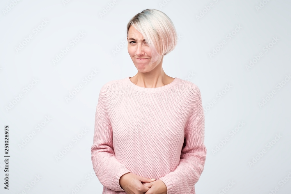 Ταπετσαρία Doubtful indecisive beautiful woman biting lips looking at camera expressing her uncertainty