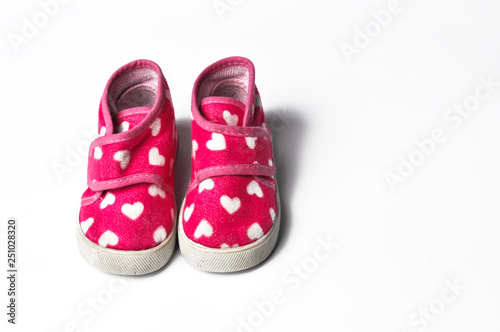 The pink children's sneakers isolated on a white background . Children's shoes. Shoes for girl