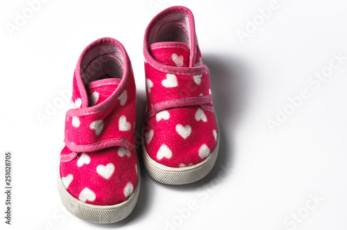 The pink children's sneakers isolated on a white background . Children's shoes. Shoes for girl