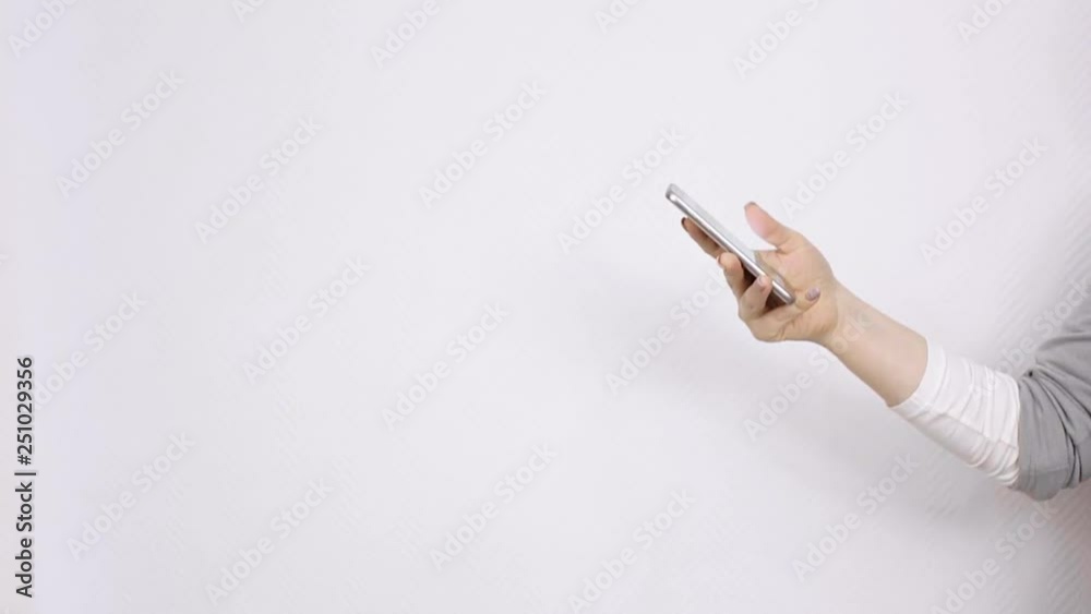 communication. female hand holding smartphone on white background. communication. female hand holding smartphone on white background.