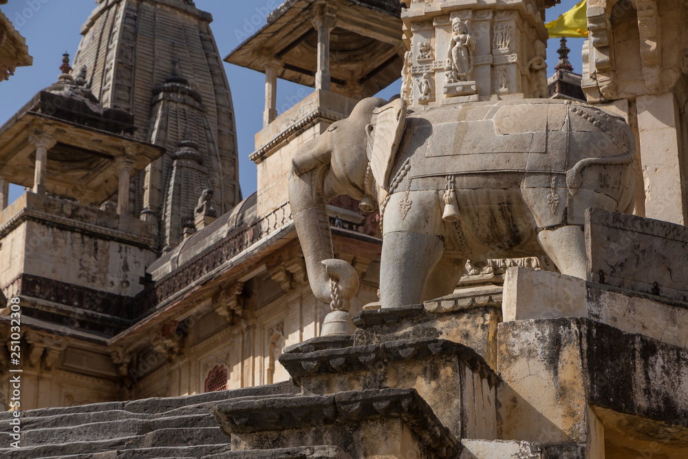 statue of elephant holding bell in ancient temple near Jaipur, India