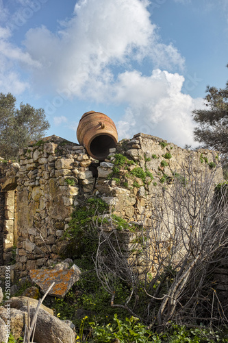 Ruin in Etia, Crete, with Amphora photo
