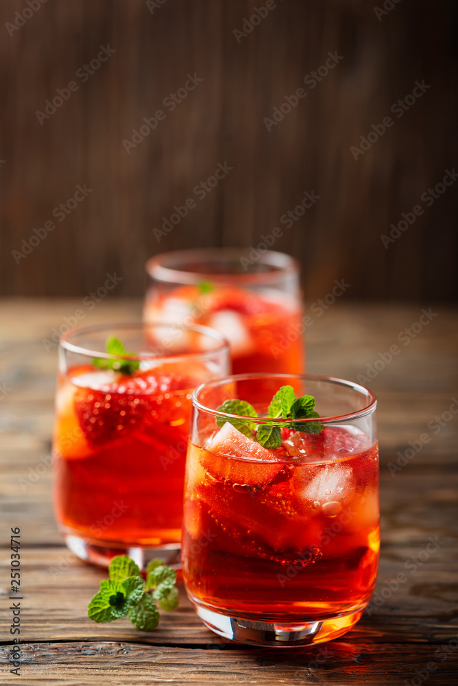 Fresh summer cocktail with ice, strawberry and mint Fresh summer cocktail with ice, strawberry and mint