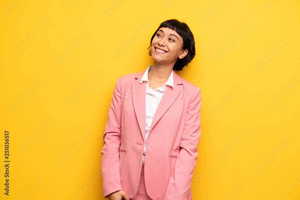 Modern woman with pink business suit smiling Modern woman with pink business suit smiling