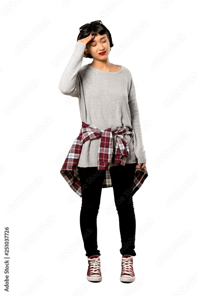 A full-length shot of a Young woman with short hair with tired and sick expression over isolated white background A full-length shot of a Young woman with short hair with tired and sick expression over isolated white background