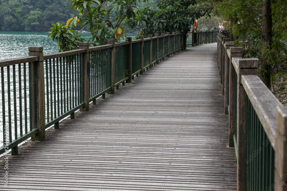 The walk way from wood for walk in sun moon lake at taiwan The walk way from wood for walk in sun moon lake at taiwan